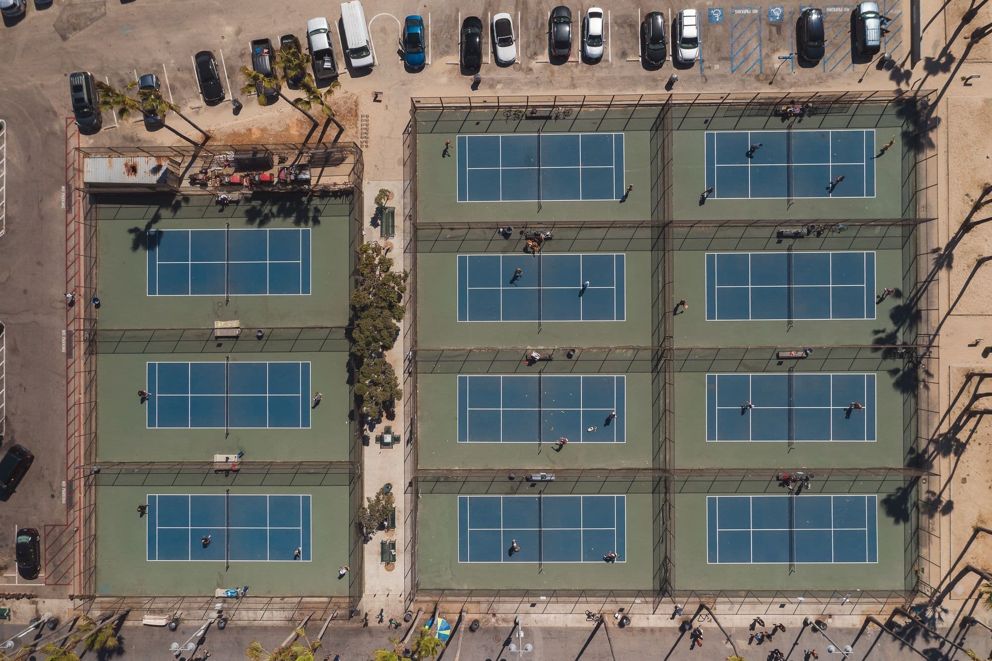Aerial view of a block of courts beside a car park