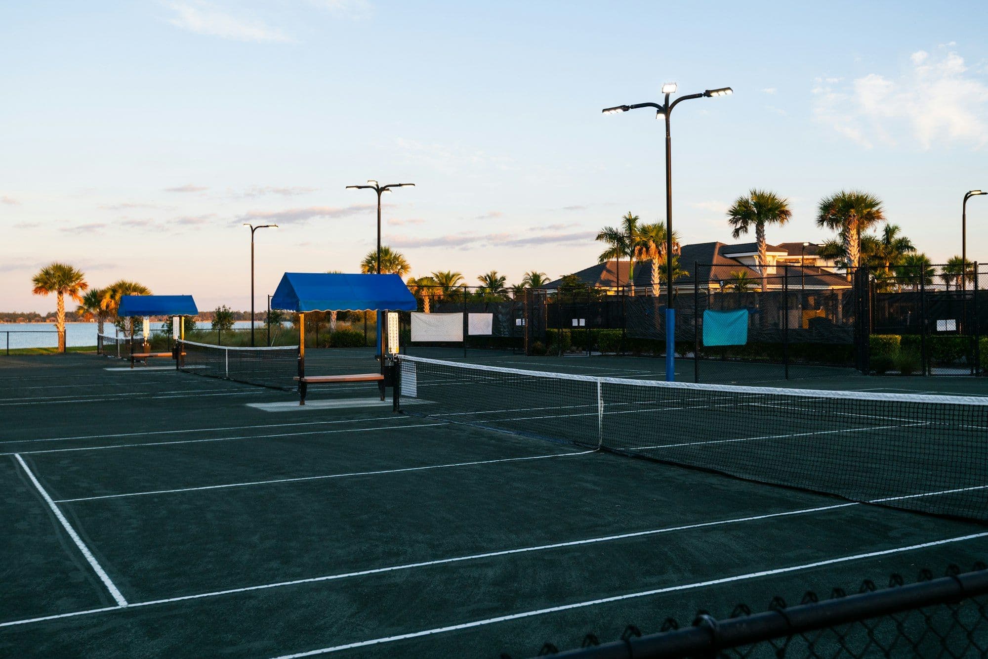 An empty court by the water at golden hour